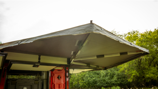 Badger trailer detail photo of a deployable canopy opened up acoss the back of the trailer.